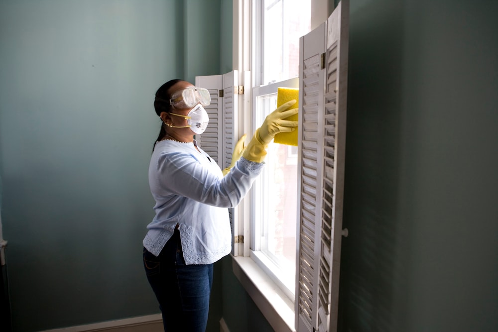 A technician performing detailed deep-cleaning on a commercial floor.